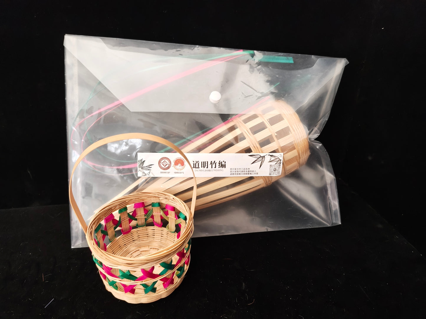Empty bamboo lattice basket with colorful pattern displayed alongside complete bamboo strips materials kit