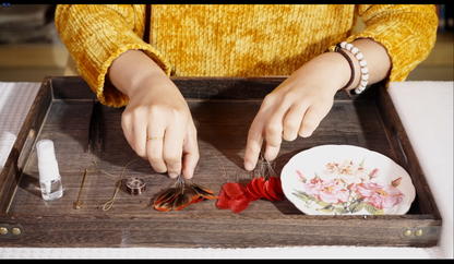 Materials kit for velvet flower rose brooch including silk floss sheets, wire, and tools