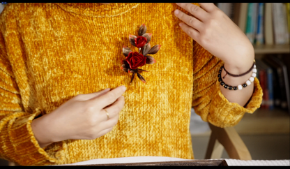 Chinese velvet flower rose brooch pinned on clothing - elegant accessory lifestyle photo