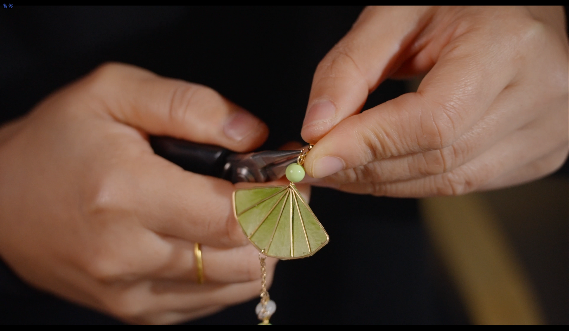 Close-up of velvet flower fan earring construction showing traditional Chinese silk floss technique
