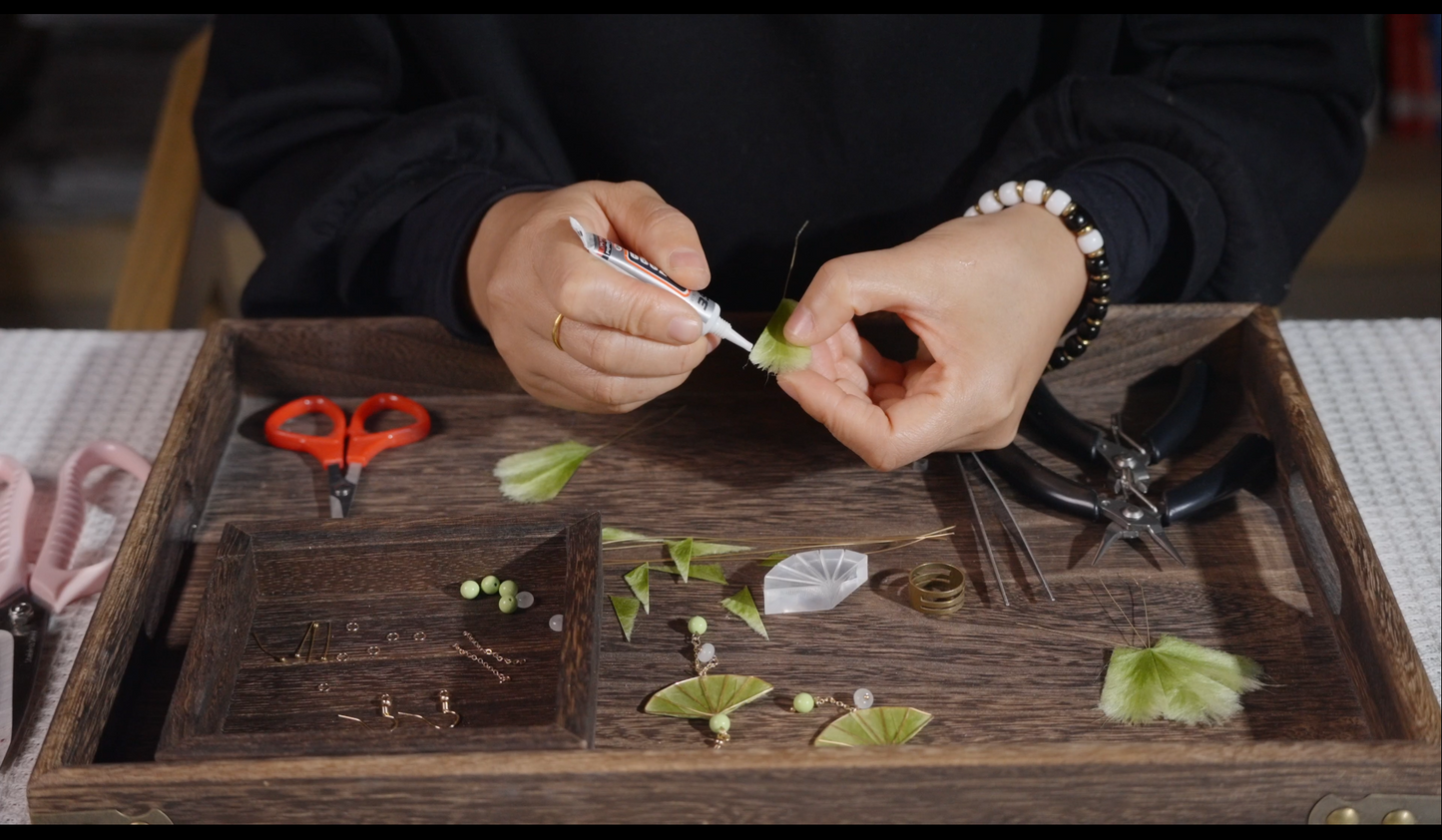 Complete materials kit for velvet flower fan earrings including silk floss, beads, tools, and ear hooks
