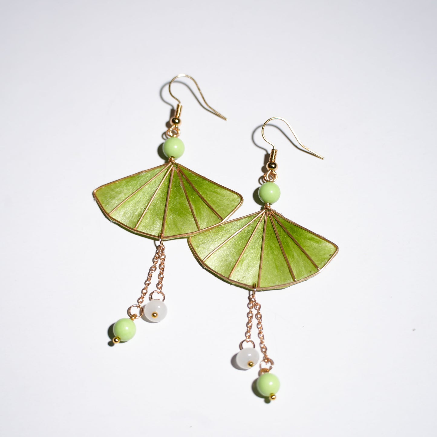 Green gradient Chinese velvet flower fan-shaped earrings with golden edges and bead tassels - product photo