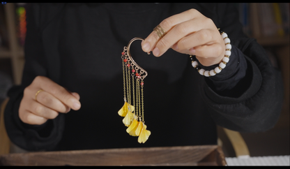 Finished Chinese velvet flower ginkgo leaf ear hooks close-up showing craftsmanship and detail